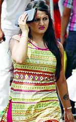 A girl tries in vain to save herself from the heat in New Delhi on Friday