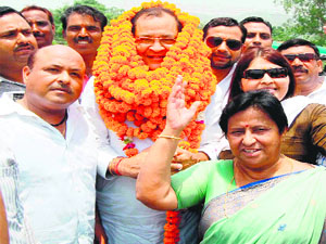 Revenue Minister Yashpal Arya is welcomed by Congress supporters in Haridwar on Friday.