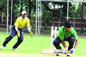 Players in action in a match during the 2nd Inter-Zonal Cricket Tournament for the Blind in Dehradun on Friday.