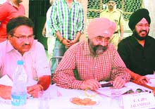 Jalandhar Development Authority Chief Administrator HS Kandhola at an auction of sites in Jalandhar on Friday.