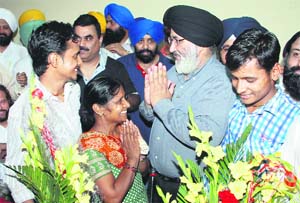Amit and Sumit, sons of a tea vendor, who have made it to IIT, being honoured by Education Minister Dr Daljit Singh Cheema in Jalandhar on Friday.