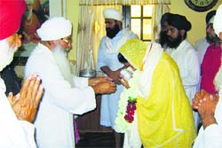 Union Minister Harsimrat Badal seeks blessings of priests at Gurdwara Nanaksar Sahib, near Jagraon, on Friday. 