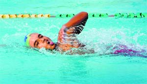 A swimmer takes part in the 39th Junior Punjab Swimming and Water Polo Championship in Ludhiana. 
