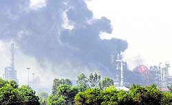 Thick clouds of smoke emanate after the blast at Guru Gobind Singh Refinery in Bathinda on Friday