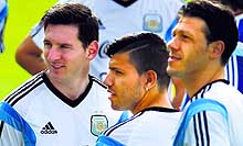 Argentinas Lionel Messi, Sergio Aguero and Martin Demichelis attend a training session in Vespasiano