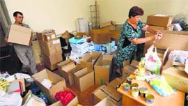 Employees prepare boxes with humanitarian aid for inhabitants of eastern Ukraine at a regional office of the Russian Red Cross in the Siberian city of Krasnoyarsk on Friday.