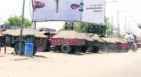 Trolleys loader with sand parked along the G T Road near the Jhahajgarh market in Amritsar on Saturday.