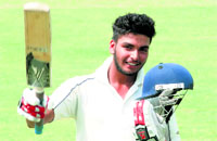 Nikhil of Ludhiana celebrates after scoring a ton.