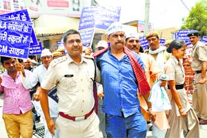 AAP activists protest against nepotism in jobs, paucity of water and electricity in Rohtak on Saturday. The activists were arrested when they tried to protest outside the local residence of Chief Minister Bhuipinder Singh Hooda.