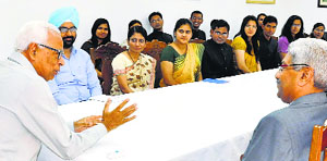 Governor NN Vohra interacts with a group of Indian Forest Service probationers at Raj Bhawan in Srinagar on Saturday.
