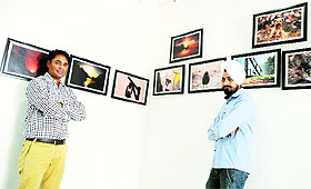 Ravinder Ravi and Guri Ludhianvi with their works.