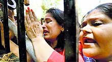 Campa Cola residents block the entrance for the BMC officials in Mumbai on Saturday
