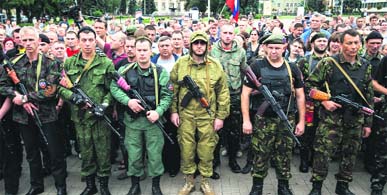 Armed pro-Russian separatists of the self-proclaimed Donetsk Peoples Republic pledge an oath during a ceremony in Donetsk on Saturday.
