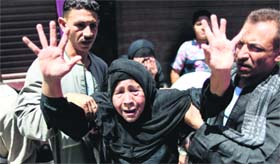 An Egyptian woman reacts outside a courtroom in Minya on Saturday.