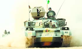 Mechanized troops patrol outside the cordoned area in North Waziristan Agency on Saturday.