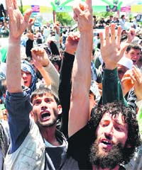 Afghan demonstrators shout slogans in support of presidential candidate Abdullah Abdullah in Kabul on Saturday.
