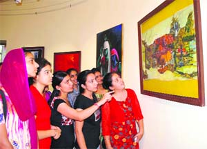 Visitors throng an exhibition-cum-painting festival of national artists at the art gallery in Amritsar on Sunday.