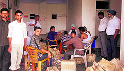 Officials of the Excise Department destroy the liquor seized, through the sewerage pipes of the District Administrative Complex, in Bathinda on Sunday