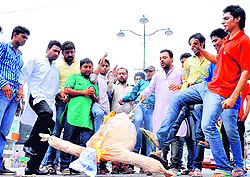 Members of the Youth Congress burn an effigy of the NDA government at Estley Hall Chowk in Dehradun on Sunday.