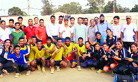 Winners of the Anuradha Memorial District Handball Tournament celebrate at the Pavilion Ground in Dehradun on Sunday. 