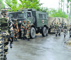 Soldiers cordon off Krankshivan colony in Sopore following inputs about the presence of two militants in  the area on Sunday.