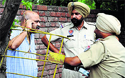 Police officials talk to Abhisheks father