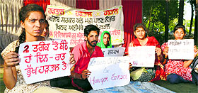 Students of Fishery College protest outside Gate No. 5 of the veterinary hospital in Ludhiana on Sunday. 