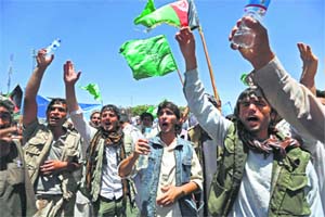 Supporters of Afghan presidential candidate Abdullah Abdullah shout slogans during a protest in Kabul on Sunday. 