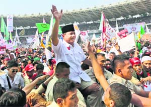 Indonesian presidential candidate Prabowo Subianto is carried by his bodyguards as he greets his supporters during a campaign rally in Jakarta on Sunday.