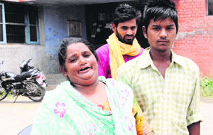 Family members of Balkar Singh wail in Amritsar on Monday.