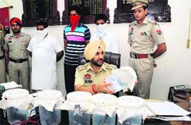 SSP Gurpreet Singh Bhullar shows the weapons recovered from the possession of the accused during a press conference in Bathinda on Monday.