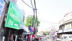 A board shows the new name of the road as Maharaja Agarsain Road.