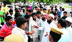 Relatives of the deceased child share a point with police officials at the Mini Secretariat in Panchkula on Monday