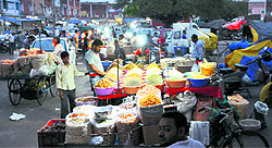 Dry fruit vendors encroach upon a road in the Grain Market, Sector 26