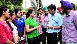 NSUI members discuss the problems of girls' hostel inmates with the DSW at Panjab University on Monday