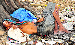 An unidentified patient lying near Gate No. 1 at Panjab University, outside PGI, Chandigarh, on Monday