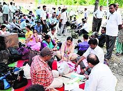 Polling parties prepare for the third phase of the panchayat polls at Doiwala near Dehradun on Monday. 