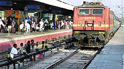 Child labourer wait for a train near the track oblivious of the danger at the Jalandhar railway station on Monday