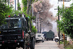 Soldiers at the encounter site in Sopore on Monday