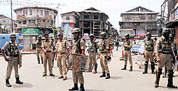 Security forces maintain a strict vigil in Srinagar on Monday