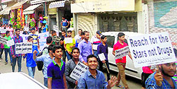 Students participate in a rally organised by the Narcotics Control Bureau against the menace of drug abuse in RS Pura