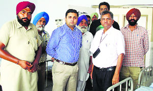 Sub-Divisional Magistrate Anand Sagar Sharma with the Civil Hospital staff in Khamano. 