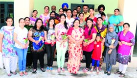 Dr Neelam Kamra, Principal of BBK DAV College for Women, along with meritorious students in Amritsar on Tuesday.