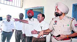 The police team and court officials help the MBD Group in taking over the possession of MBD Krishna Project in Jalandhar on Tuesday.