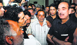 Congress leader Ghulam Nabi Azad interacts with party workers in Srinagar on Tuesday. Tribune Photo: Amin War