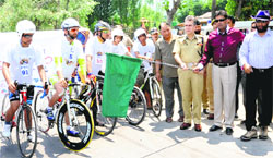 AG Mir, IGP, Kashmir range, flags off the sports triathlon in Srinagar on Tuesday. A Tribune photograph
