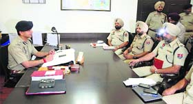 Pramod Ban, the new Commissioner of Police, interacts with senior officers in Ludhiana on Tuesday morning.