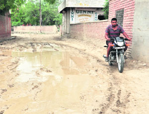 A view of the unlaid road due to which commuters face problems at Lal Singh Basti in Bathinda.