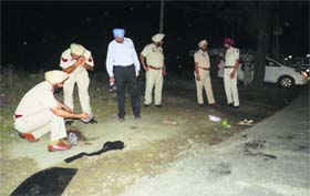 The police at the encounter site in Moga.