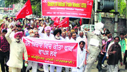 Members of CPIM protest againts Prime Minister of India, Narendra Modi against railway fare hike in Jalandhar DC Office on Wednesday. Photo Sarabjit Singh